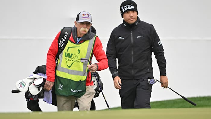Mike “Fluff” Cowan caddies for C.T. Pan at the WM Phoenix Open.